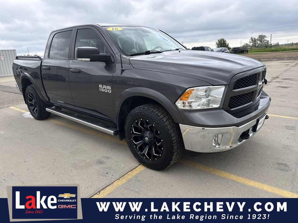 2016 RAM 1500 Outdoorsman in Granite Crystal Metallic Clearcoat — front three-quarter view