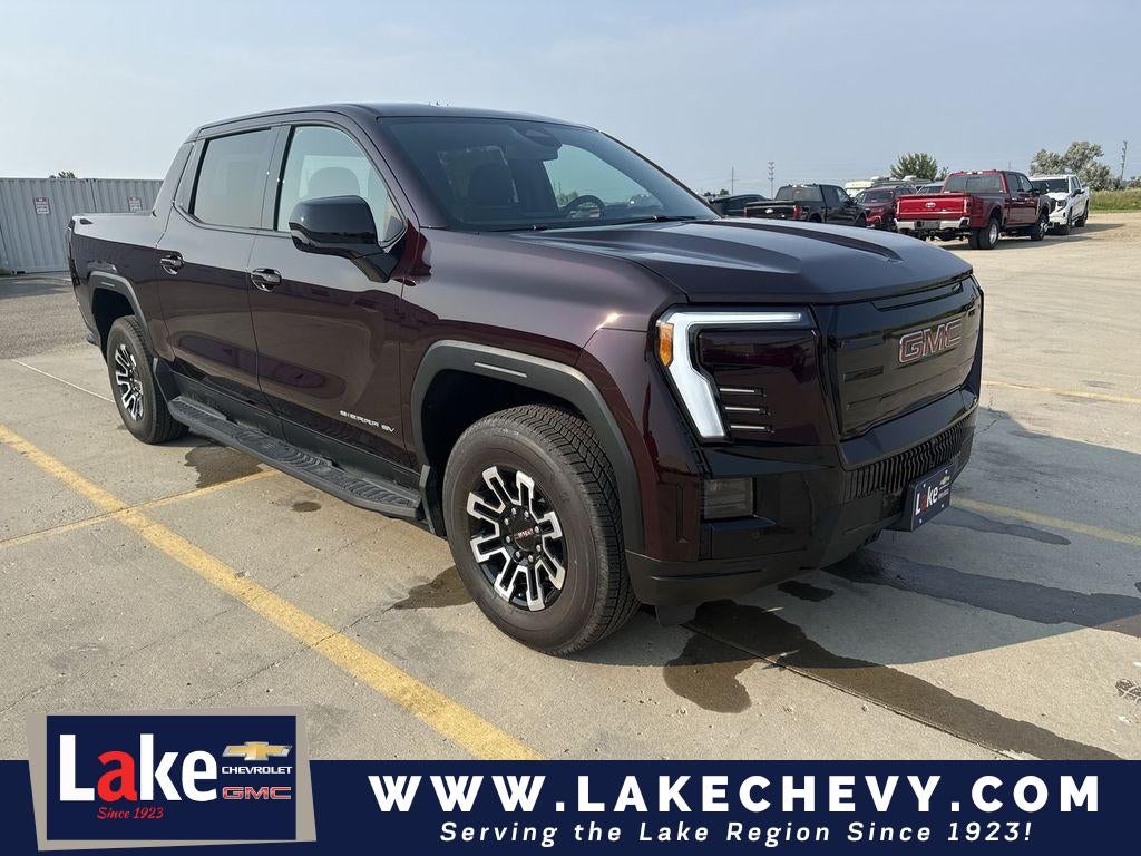2026 GMC Sierra EV Elevation Standard Range in Dark Ember Metallic — front three-quarter view