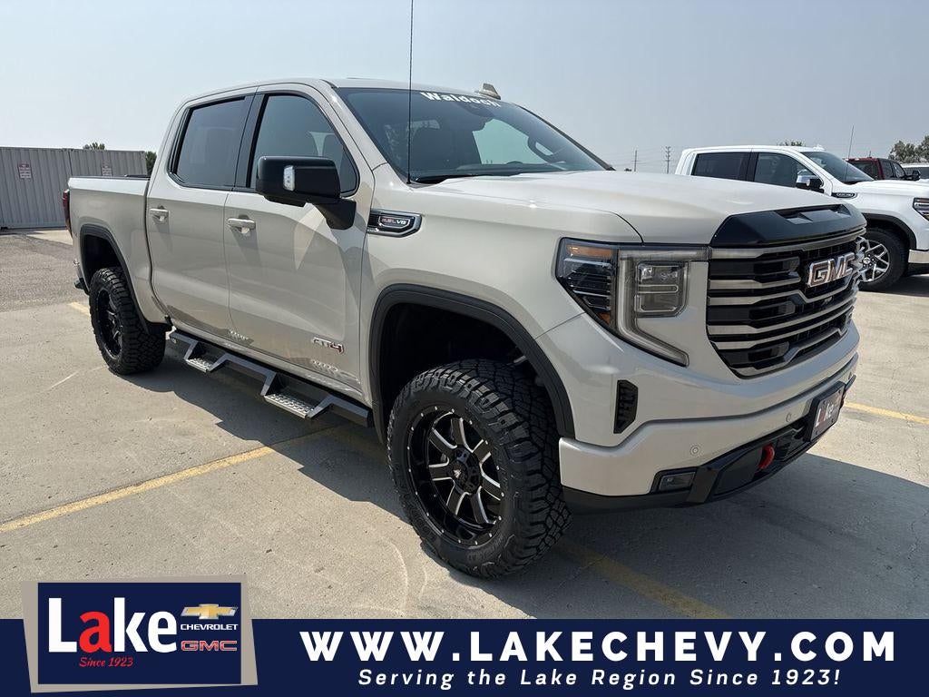 2026 GMC Sierra 1500 AT4 in Coastal Dune — front three-quarter view